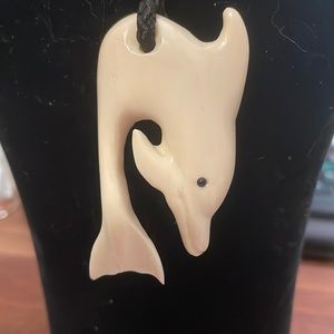 Hand carved dolphin necklace